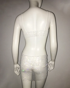 Detailed view of white mesh two-piece set featuring sparkling rhinestones on fabric