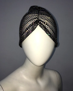 Detailed close-up of crystal rhinestones on black mesh elastic turban hat