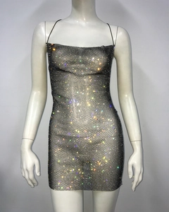 Detailed macro view of colorful rhinestones on a black mesh sexy party mini dress