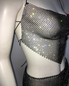 Detail of black mesh two-piece set featuring colorful rhinestones and halter neck design