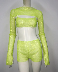 Detail of neon green rhinestone three-piece set with shrug and crop top set