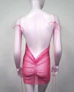 Close-up of pink rhinestone mesh mini dress with crisscross back tie and bow details