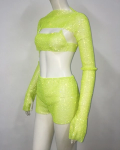 Detail of neon green rhinestone mesh set with long sleeve crop top and matching shorts