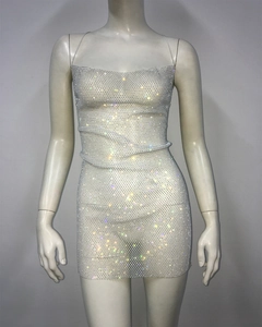 Detailed close-up of a sexy mesh mini dress with shimmering colorful rhinestones