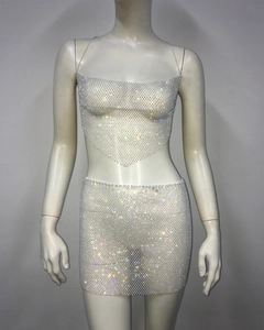 Detail of rhinestone mesh set showing sparkling crop top and bodycon skirt on mannequin