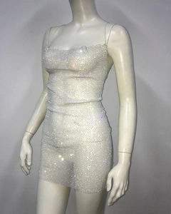 Detailed macro view of shimmering rhinestones on mesh bodycon mini party dress