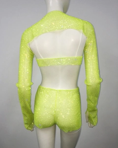 Detail of neon green rhinestone mesh set showing back view and sparkling crystal texture