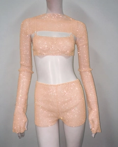 Detail of three-piece peach rhinestone set featuring high-neck shrug and shorts