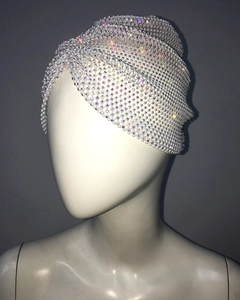 Close-up of white mesh rhinestone turban cap with sparkling crystal bead embellishments