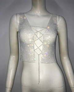 Macro view of silver rhinestone mesh top with V-neck cross chain lace-up design