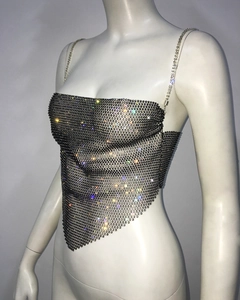Detail of black mesh camisole with colorful rhinestones and metal chain straps