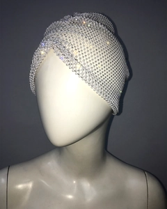 Detailed view of white stretchy turban hat with shimmering rhinestones and beads
