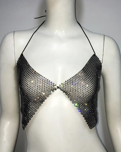 Close-up of black halter top with sparkling rhinestones and mesh texture detail