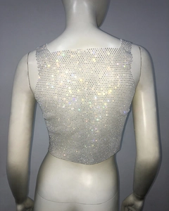 Detailed back view of a silver rhinestone mesh crop top with shimmering chain details