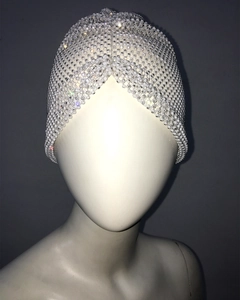 Detail of white beaded festive turban with sparkling rhinestones for party wear