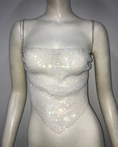 Macro detail of silver mesh top featuring sparkling rhinestones and delicate chain straps