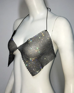 Detail of black rhinestone mesh halter top with iridescent crystals on metal mesh