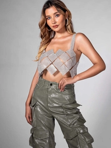 Sparkly silver rhinestone patchwork crop top paired with olive green leather cargo pants