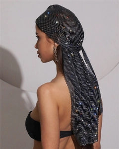 Close-up of black mesh turban cap with sparkling silver rhinestones and long tassels