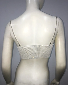 Detail of sparkly rhinestone mesh crop top back view with delicate metal chain straps