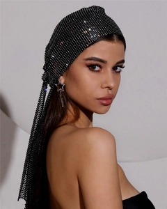 Detail view of black fishnet turban with rhinestones and matching star earrings