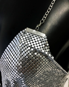 Detail view of silver metal sequin mesh top with chain strap and lobster clasp