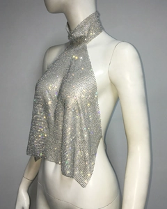 Detail of silver rhinestone mesh halter top with metallic sequins and open back design