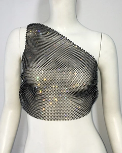 Detail view of black fishnet one-shoulder top with sparkling colorful rhinestones