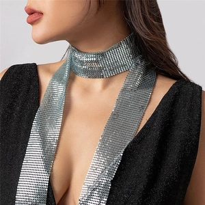 Detailed view of shimmering silver metal sequin scarf necklace with luxury drape effect