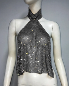 Detailed close-up of sparkling silver rhinestone metal mesh halter top on a mannequin