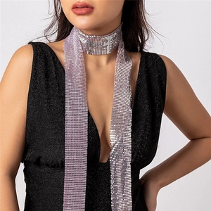 Detail of lavender metal sequin scarf with fluid metallic mesh texture on model