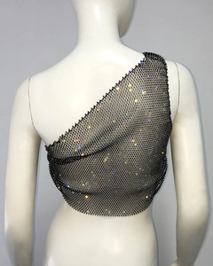 Detail of black mesh one-shoulder top with colorful rhinestones and sparkling crystals
