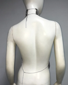Detail of silver metallic mesh halter top showing back chains and sexy neck choker link