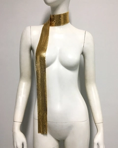 Close-up of golden metallic sequin mesh scarf necklace with a glossy texture
