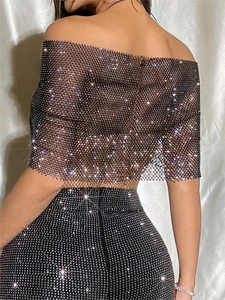 Sparkling black rhinestone mesh crop top and high waist set shown from a back view