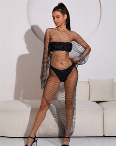 Close-up of sparkling rhinestones on black mesh fishnet dress with sexy see-through texture
