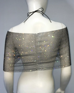 Detail of black fishnet shrug featuring sparkling colorful rhinestones and ties