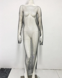 Close-up of black mesh rhinestones dress featuring long sleeves and side slit detail