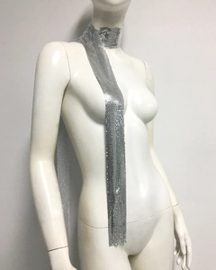 Detail of silver metallic sequin mesh tie scarf showing reflective texture and drape