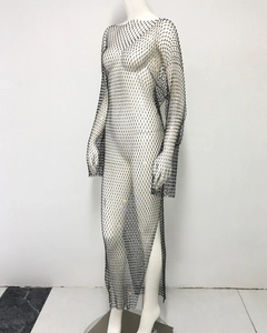 Close-up of black mesh dress with glittering rhinestones and high side slit detail