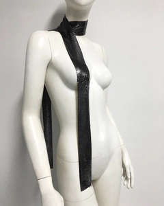 Close-up detail of the black sequin metal mesh scarf showing the woven texture and metallic sheen