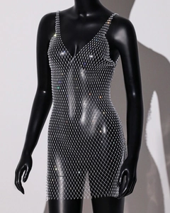 Detail of silver mesh dress featuring sparkling rhinestones and delicate thin straps