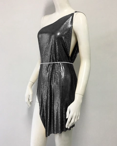 Detail of grey metal mesh dress with sequin texture and side chain decoration