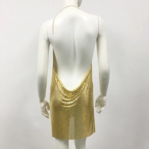Detail of gold metal mesh mini dress showing cowl back design and slim chain straps