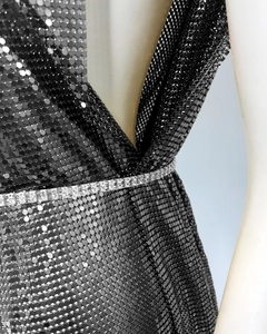 Detail of black sequin mesh fabric with rhinestone waist belt on fashion mini dress