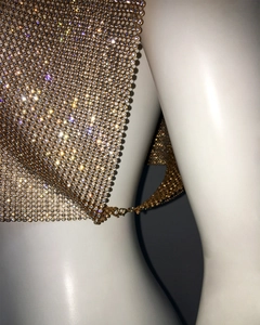Close-up of gold metal mesh top with rhinestones and adjustable lobster clasp