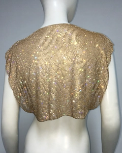 Detailed back view of golden sequin mesh crop top with shimmering rhinestone texture
