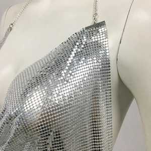 Detail of silver metallic sequin halter top with adjustable chain straps and mesh texture