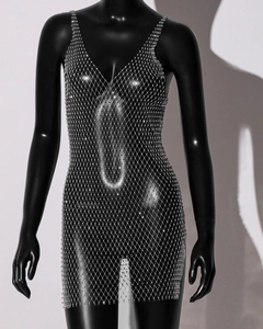Close-up of sparkling silver rhinestone mesh fishnet dress on black mannequin
