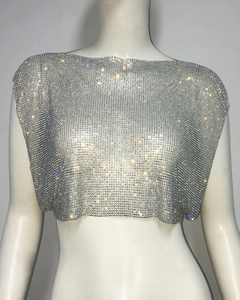 Close-up of sparkling silver rhinestone mesh crop top with shimmering metal link details